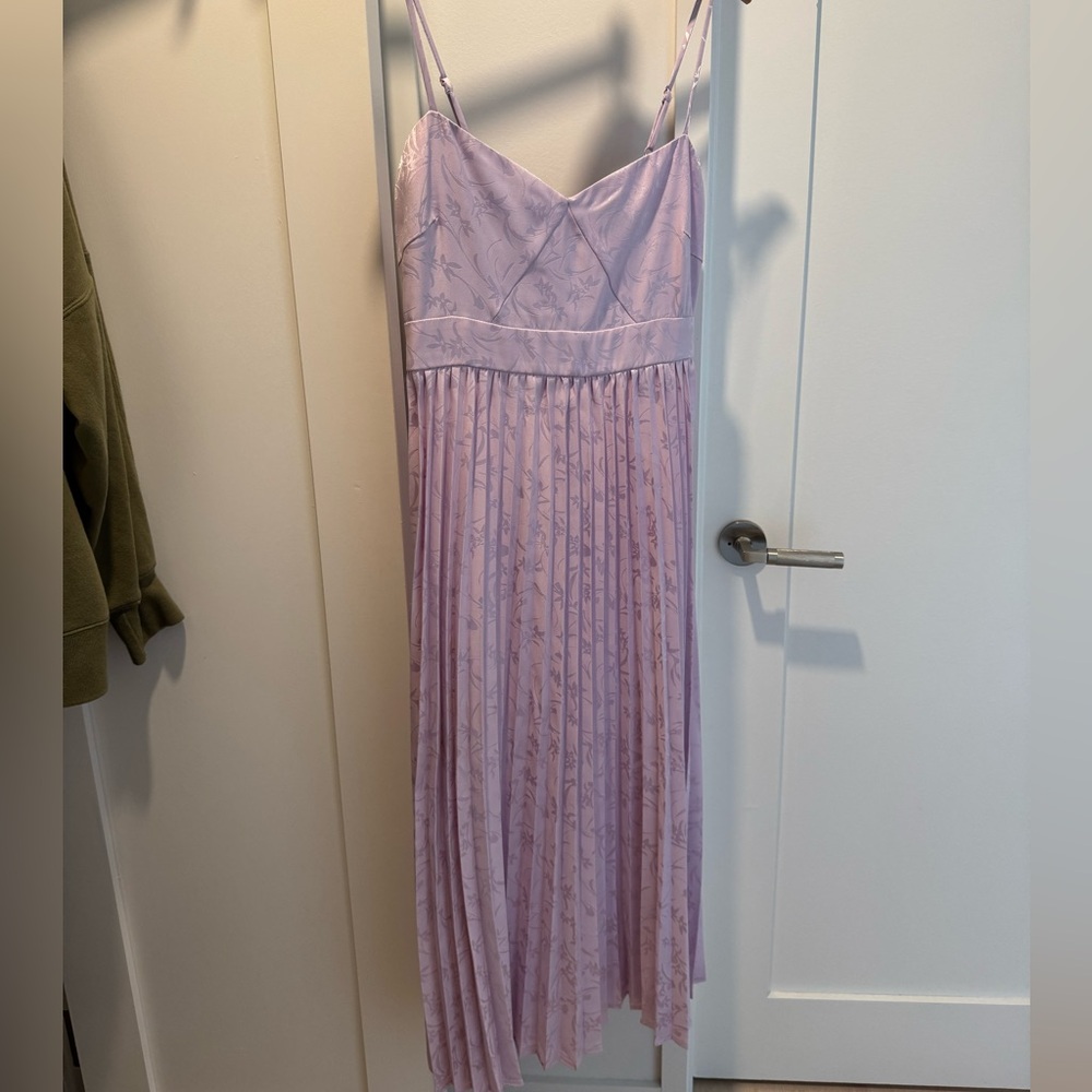 Wore once to a spring wedding, not needed anymore.